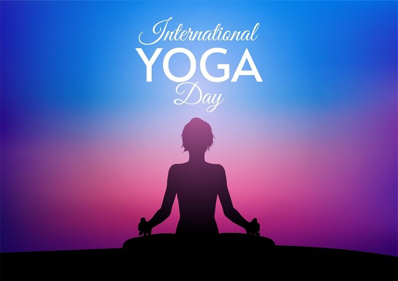 International day of yoga card with female against sunset sky