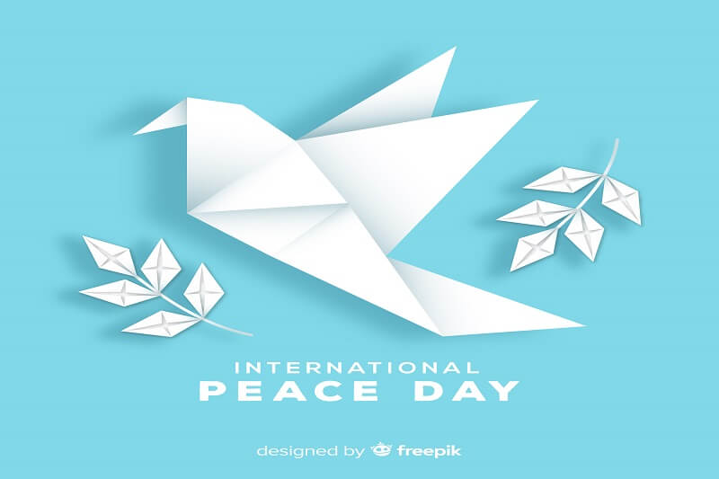 Origami peace day background with dove